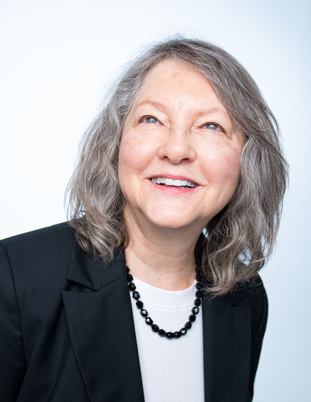 Melanie, business portrait on cool grey