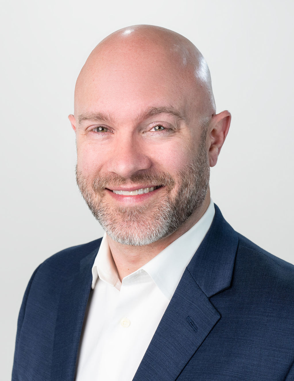 Michael, corporate headshot in navy blazer