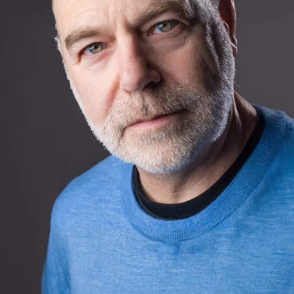 Close-crop character portrait in blue sweater